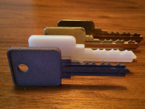3D printed prototype keys (and one contracted-out metal prototype) for our old condo's exterior gate