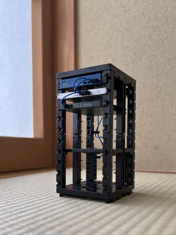 A tiny gachapon rack with 3 of 4 branded components (that's how they get you!!!)